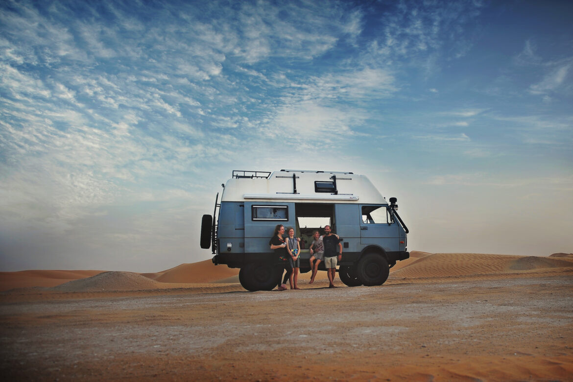 Kirsty Larmour and her global family with their camper, exploring the world.